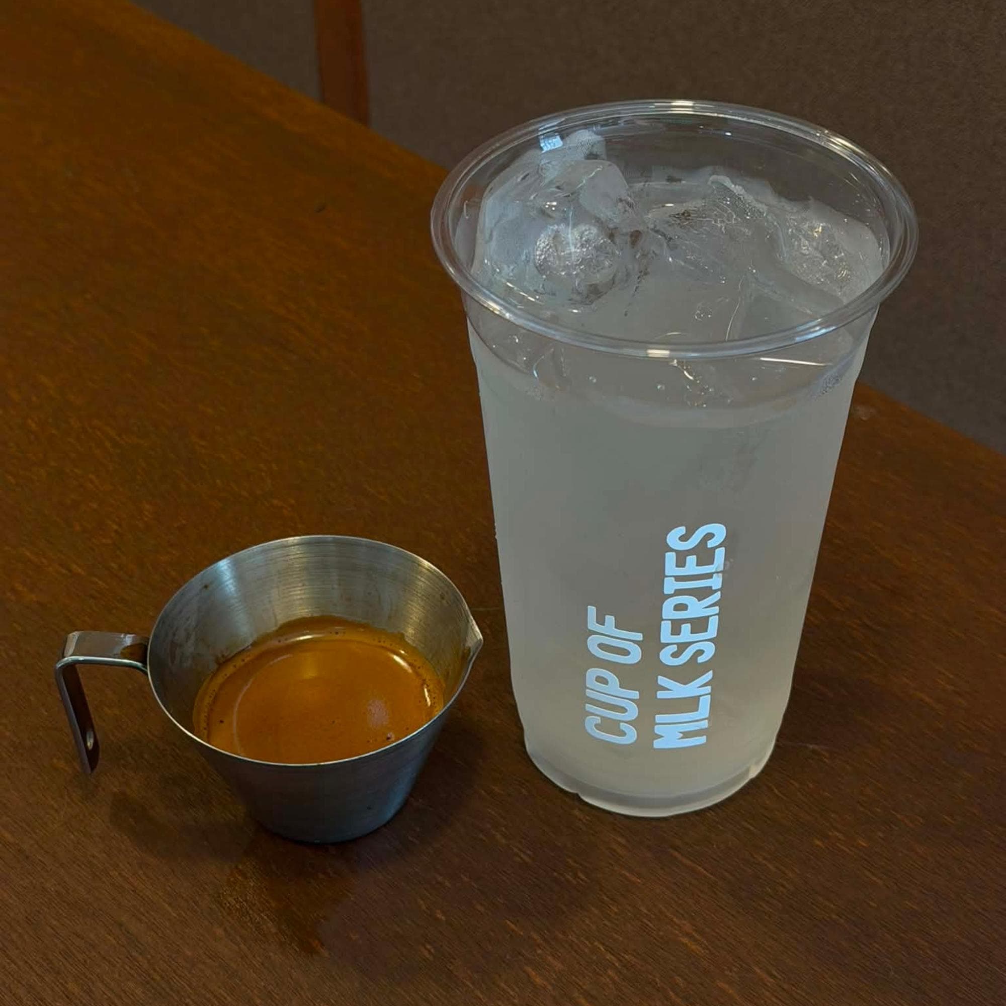 Cup Of Mlk Series drink served on a wooden table